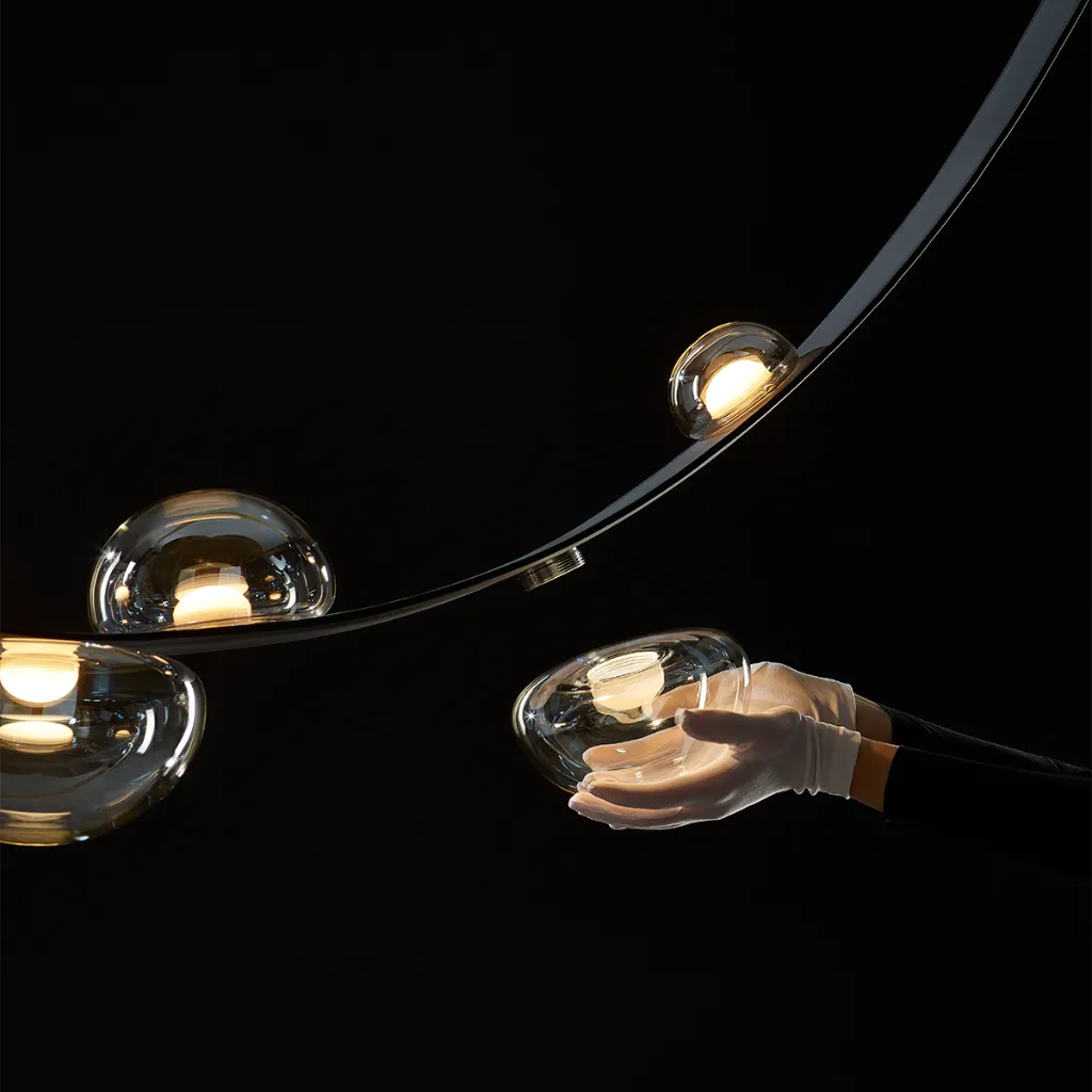 dew-drops-lighting-detail-hand.webp